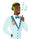 African groom listening to music in headphones.