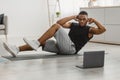 African Guy Doing Elbow To Knee Abs Crunches At Home Royalty Free Stock Photo