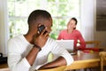 African guy making a phone call and looking back at woman Royalty Free Stock Photo