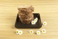 African handmade black soap with white flowers