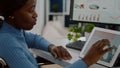 African invalid manager woman using pc and tablet in same time Royalty Free Stock Photo