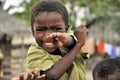 African kid playing with hands happy
