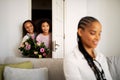 African Kids Girls Holding Flowers Standing Behind Mom& x27;s Back Indoors Royalty Free Stock Photo