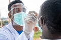 African lab scientist taking nasal sample from a man