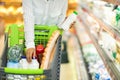 African Lady Buys Food With Shopping Cart In Supermarket, Cropped Royalty Free Stock Photo