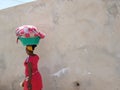 African lady carrying basket