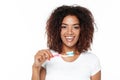 African lady holding toothbrush with toothpaste. Royalty Free Stock Photo