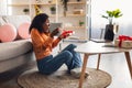 African Lady At Laptop Opening Gift Celebrating Birthday Online Indoors