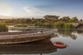 African lake with boat, sunset. Lubango. Angola.