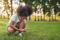 African little black girl prepare shoe before running at outdoors park Royalty Free Stock Photo