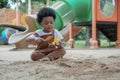 African little boy with afro hair enjoy playing sand on playground outdoors Royalty Free Stock Photo