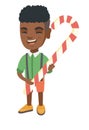 African little boy holding christmas candy cane. Royalty Free Stock Photo