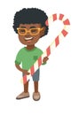 African little boy holding christmas candy cane. Royalty Free Stock Photo