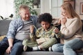 Boy getting present from his foster parents Royalty Free Stock Photo