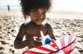 African little boy playing at the beach Royalty Free Stock Photo