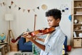 Home lesson for boy playing the violin Royalty Free Stock Photo