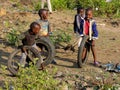 African little children playing with old moto wheels