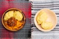 African maize porridge called ugly in bowl. nshima, with meat and sweet potatoes. flat lay