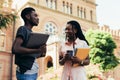 African male and female college students talking on campus Royalty Free Stock Photo