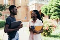 African male and female college students talking on campus Royalty Free Stock Photo