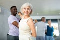 African male novice student of fitness studio practices paired Latin American rumba dance Royalty Free Stock Photo