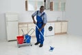 African Male Worker Cleaning Floor With Mop Royalty Free Stock Photo