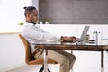 African Man Bad Posture Working Typing Royalty Free Stock Photo