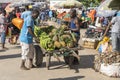 African man carrying a cart of tropical fruits at a local street food market on the island of Zanzibar, Tanzania, east Africa Royalty Free Stock Photo