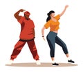 African man and Caucasian woman dancing hip hop. Energetic young adults in casual clothing performing street dance moves Royalty Free Stock Photo