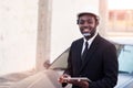 African man construction engineer worker standing and use teblet with the car Royalty Free Stock Photo