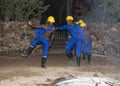 African man dancing as minders slaves