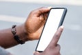 African man hands holding two smartphone with blank space screen for your texting or news content Royalty Free Stock Photo