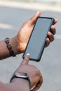 African man hands holding two smartphone with blank space screen for your texting or news content Royalty Free Stock Photo