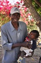 African man holding child