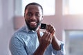 African man holding a wedding ring Royalty Free Stock Photo