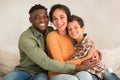 African Man Hugging Middle Eastern Wife And Little Son Indoor Royalty Free Stock Photo