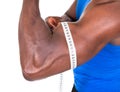 African Man Measuring His Biceps Royalty Free Stock Photo