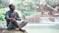 African man meditate spiritual peaceful praying and wishing in green nature Royalty Free Stock Photo