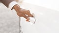 African Man Opening Auto Door Outdoors, Closeup, Cropped