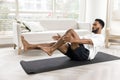 African man performing core exercise, boat pose or bicycle crunch Royalty Free Stock Photo