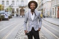 African man posing on street with retro photo camera Royalty Free Stock Photo