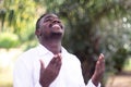 African man praying for thank god with the green nature Royalty Free Stock Photo