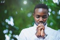 African man praying for thank god in the green nature Royalty Free Stock Photo