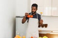 African man preparing healthy food at home in kitchen Royalty Free Stock Photo