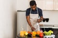 African man preparing healthy food at home in kitchen Royalty Free Stock Photo