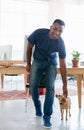 African man, puppy and smile in office for research and planning for business ideas and creativity. Intern or trainee at Royalty Free Stock Photo