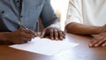 African man putting signature on agreement close up image Royalty Free Stock Photo