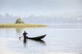 African man riding a canoe