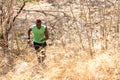 African man runner jogging and running trail in the meadow forest. Royalty Free Stock Photo