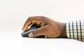 African Man's Hand Holding and Clicking a Computer Mouse Isolated on White Background, Side View; Data Entry. Royalty Free Stock Photo